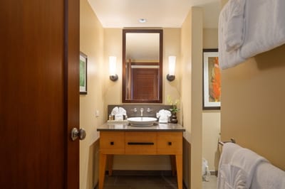 The lighting is soft, the mirror is kind, and the faucet pours peace with the poise of a spa-trained sommelier