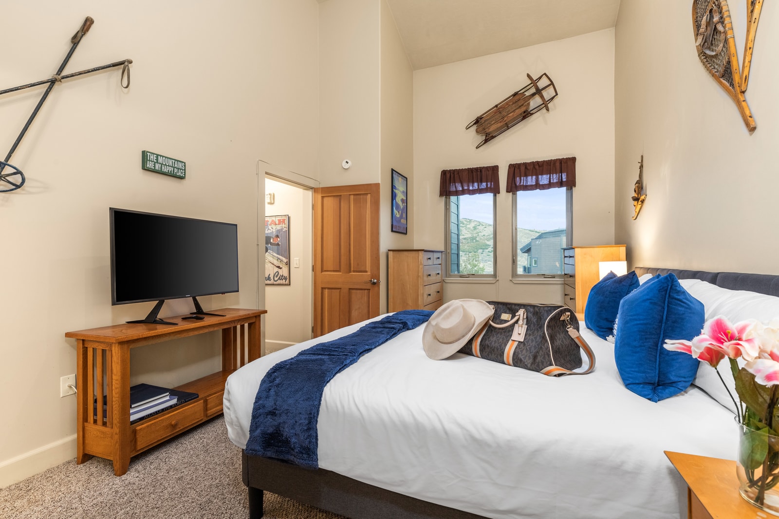 King bed, Smart TV, and rustic alpine décor make the primary suite a relaxing private escape.