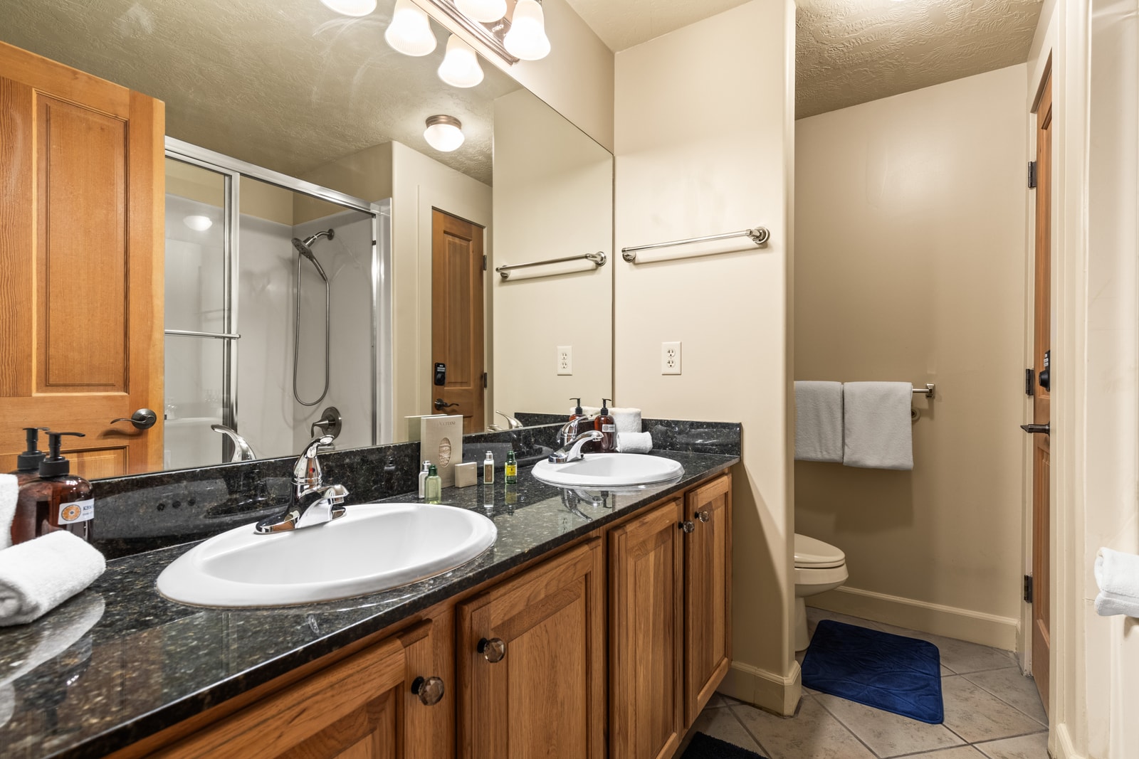 Your ensuite includes granite vanity, full shower/tub combo, and luxe L’Occitane amenities.