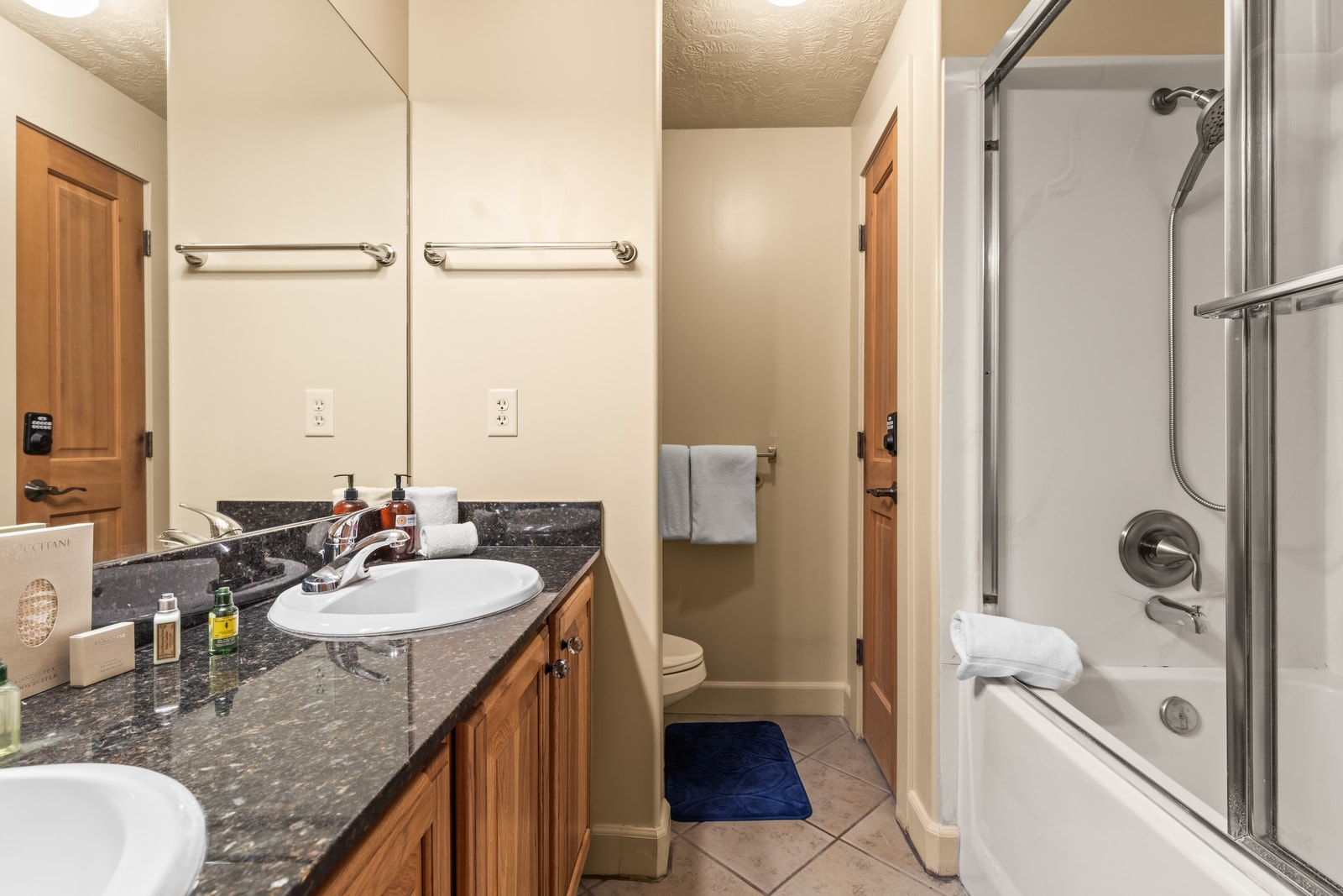 Walk-in layout and thoughtful touches elevate your ensuite bath experience.