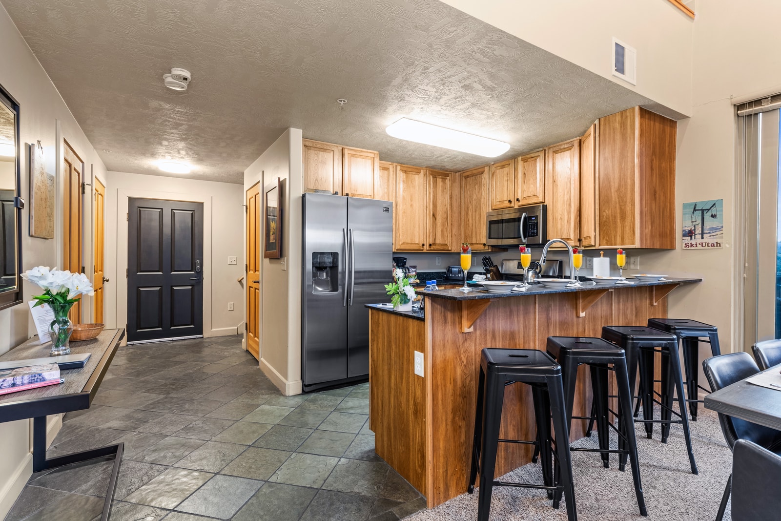 Galley-style layout offers plenty of prep space, storage, and easy access to dining.
