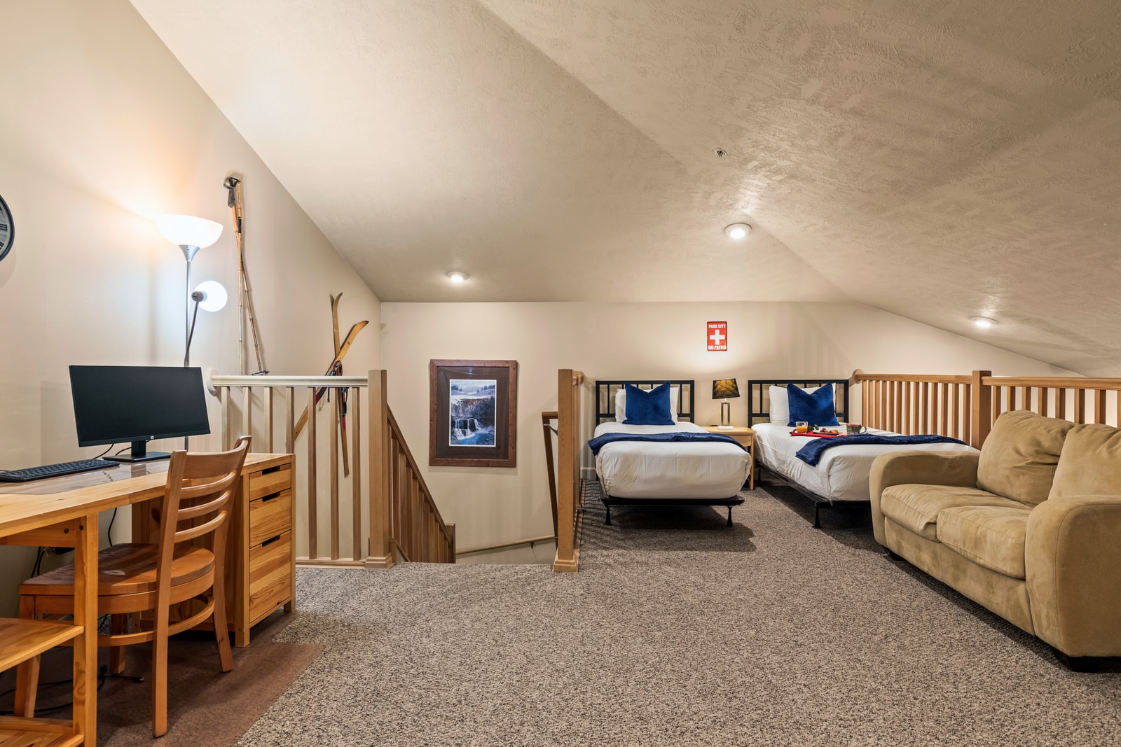 Spacious loft setup includes a Queen plus two Twin XL beds, ideal for families or kids.