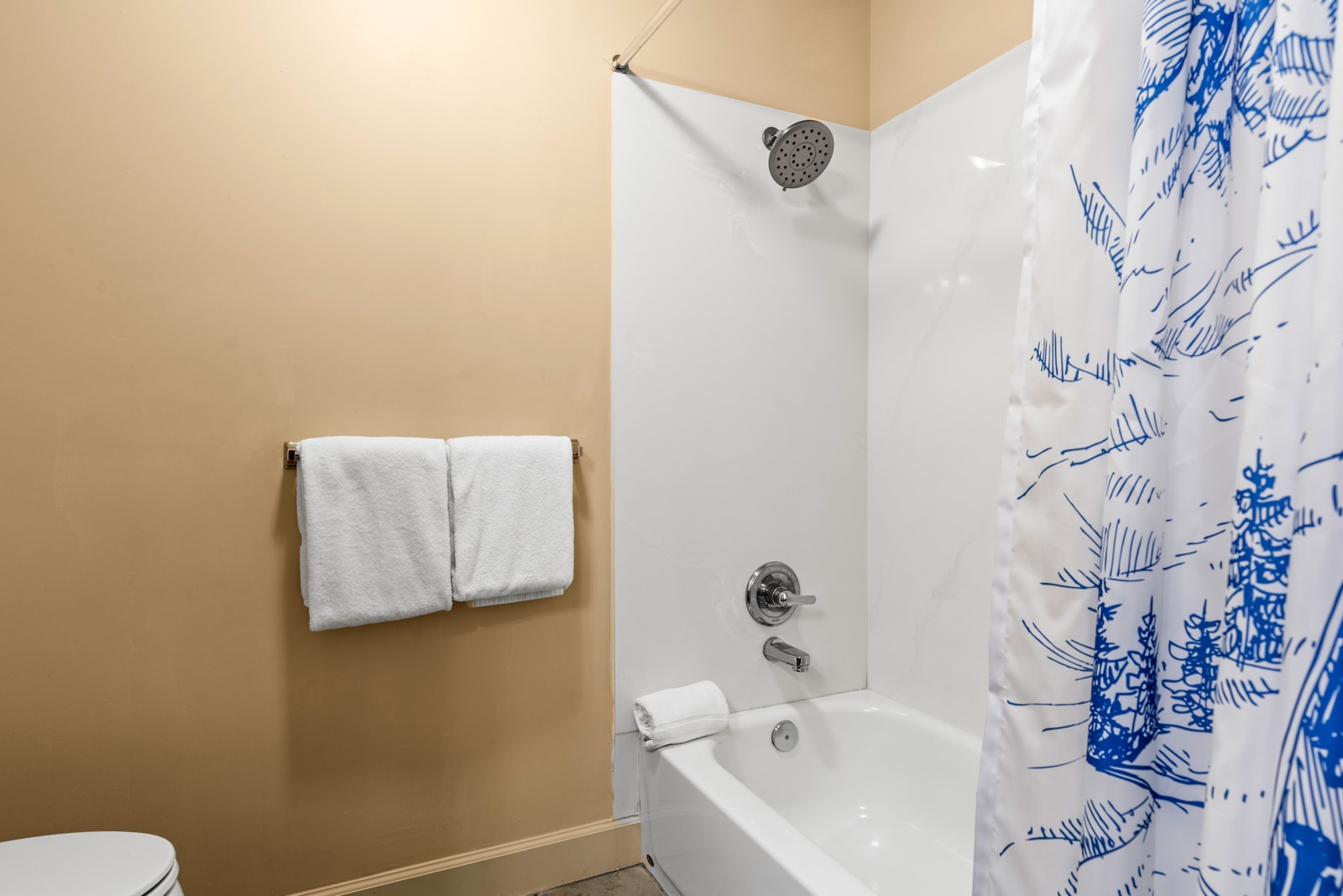 Third full bath with tub/shower combo, granite vanity, and hotel-quality amenities.