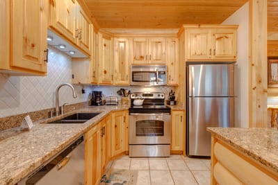 Your fully equipped kitchen includes stainless appliances, granite countertops, and everything needed for home-cooked meals.