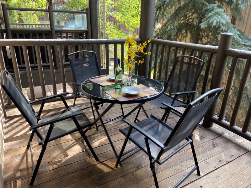 Enjoy morning coffee or an evening drink on your private balcony with tree-lined views.
