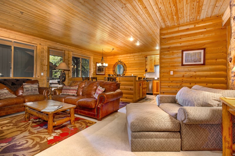 Bright and comfortable lounge area with large windows and inviting furnishings.