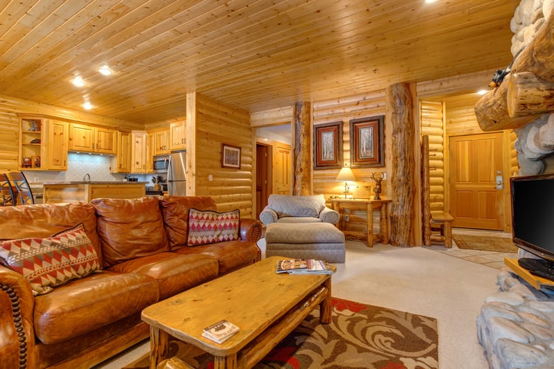 Fireside lounging with leather seating and a warm, inviting layout perfect for après-ski evenings.