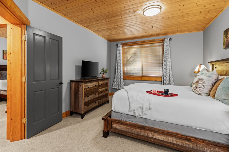 This bedroom offers privacy and comfort with a King bed and convenient bath access. BBL-351A