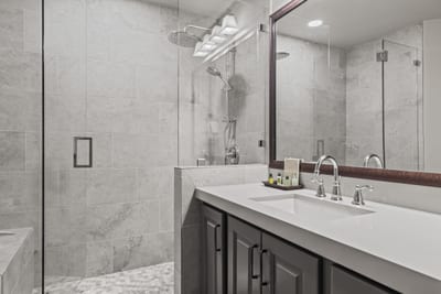 Dual sinks and stone details make this master bathroom both functional and stylish. BBL-351A