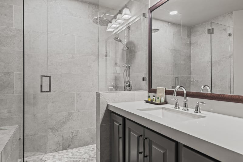 Dual sinks and stone details make this bathroom both functional and stylish. BBL-351A