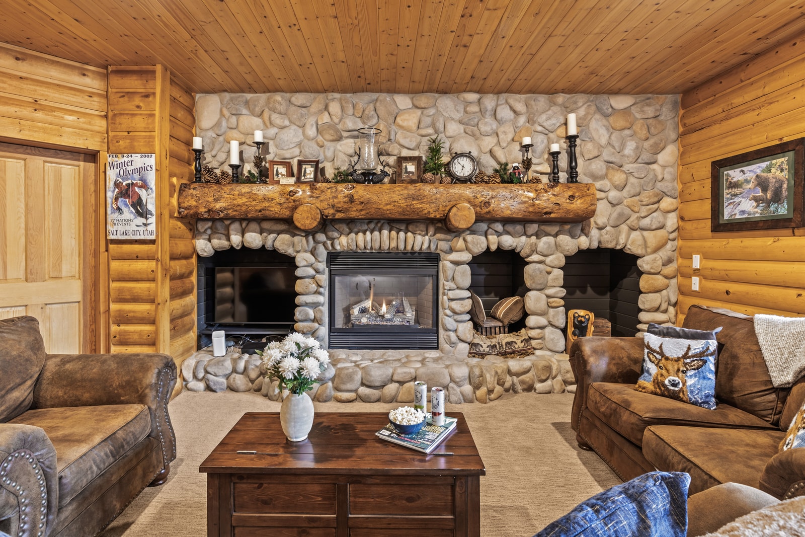 Cozy up by the fireplace in your spacious living room, complete with a large sectional and flat-screen TV for movie nights after mountain adventures. BBL-351A