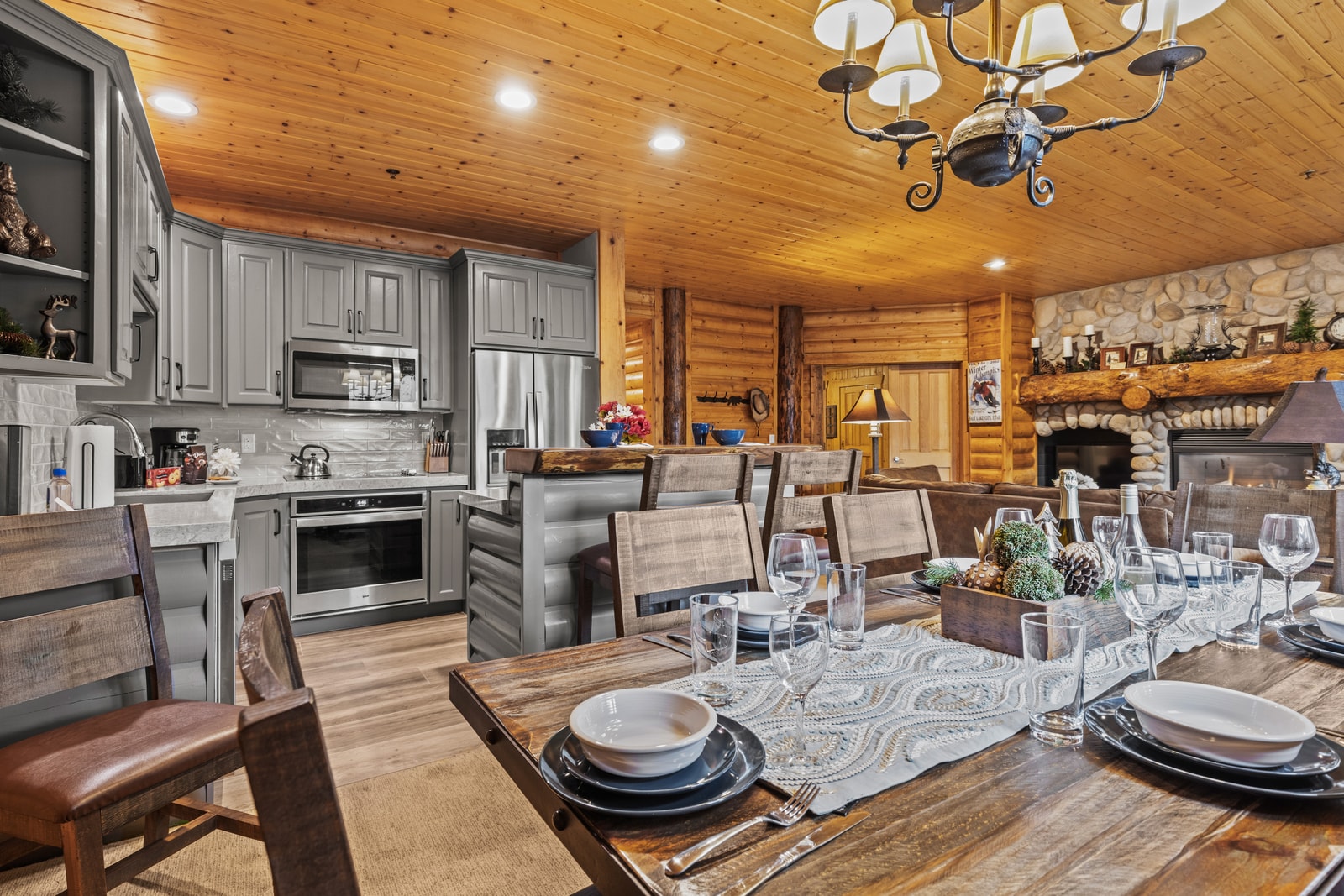 Gather for dinner beneath the chandelier in your dining area with seating for six and warm wood finishes. BBL-351A