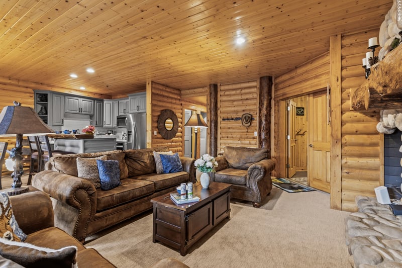 Flow from the living area to the dining space with ease in this open, wood-paneled layout. BBL-351A