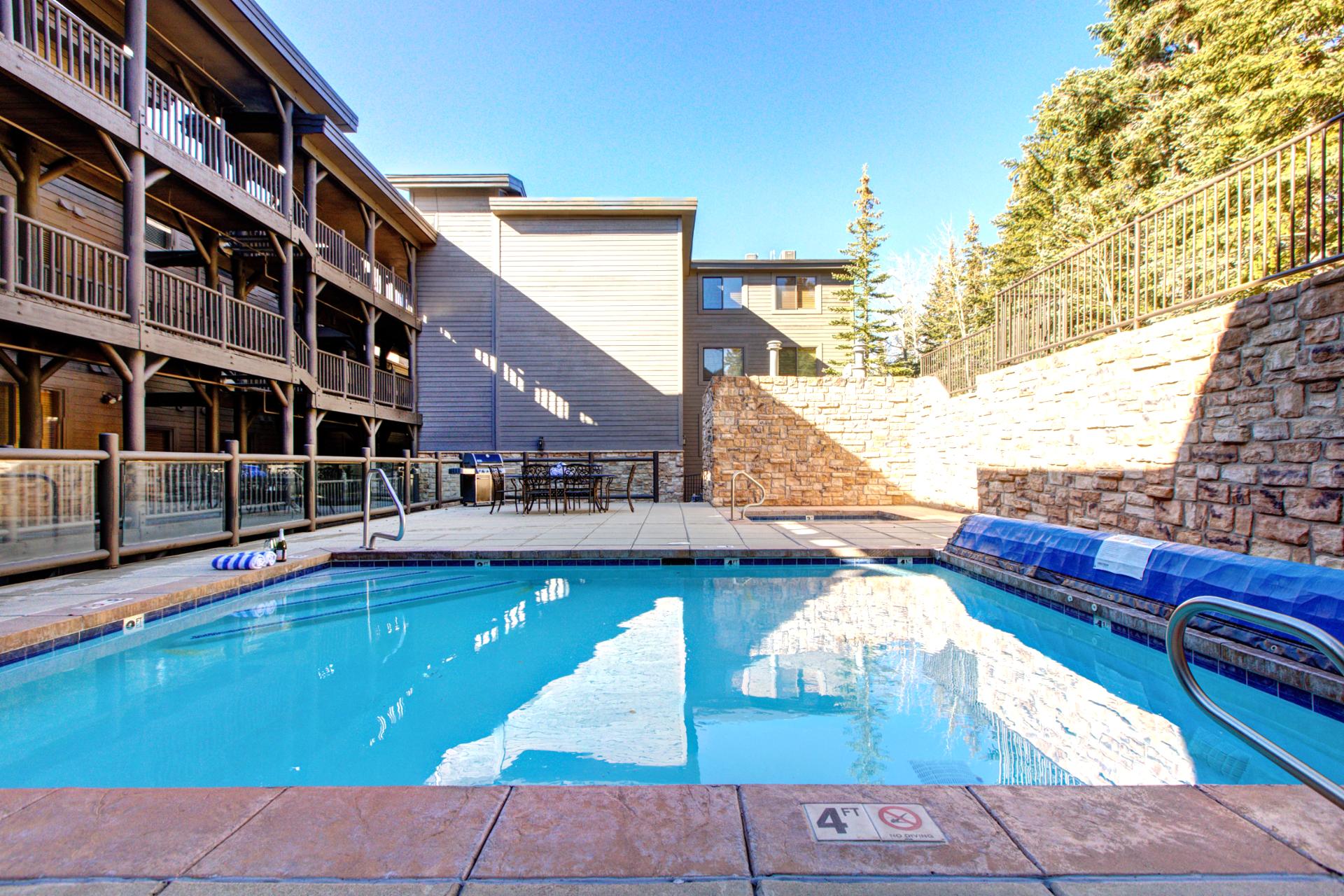 Cool off in the shared outdoor pool, perfect for summer afternoons between mountain adventures.
