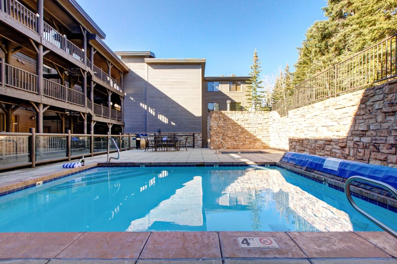 Cool off in the common outdoor pool, perfect for summer afternoons between mountain adventures.