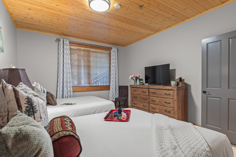Relax in this spacious guest room with two Queen beds and lodge-inspired decor.