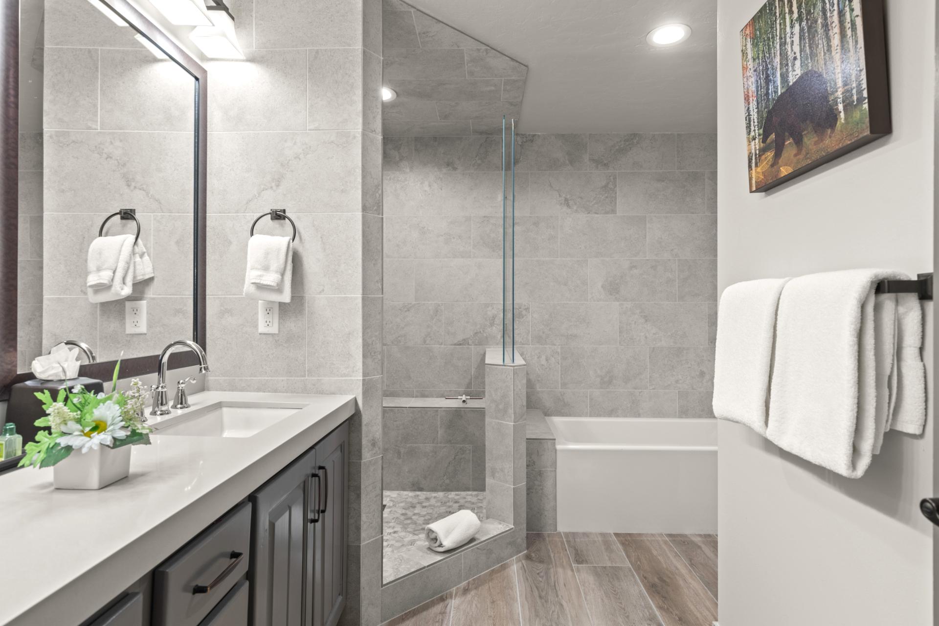 Enjoy a spa-like refresh in your ensuite bath with a vanity and walk-in shower.