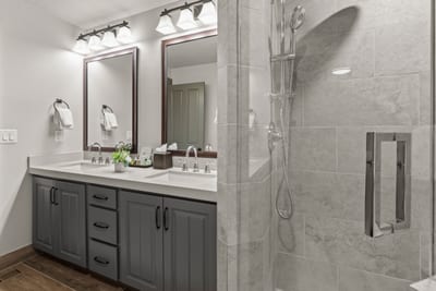 Fresh finishes and a full-size shower make this ensuite bath both functional and stylish.