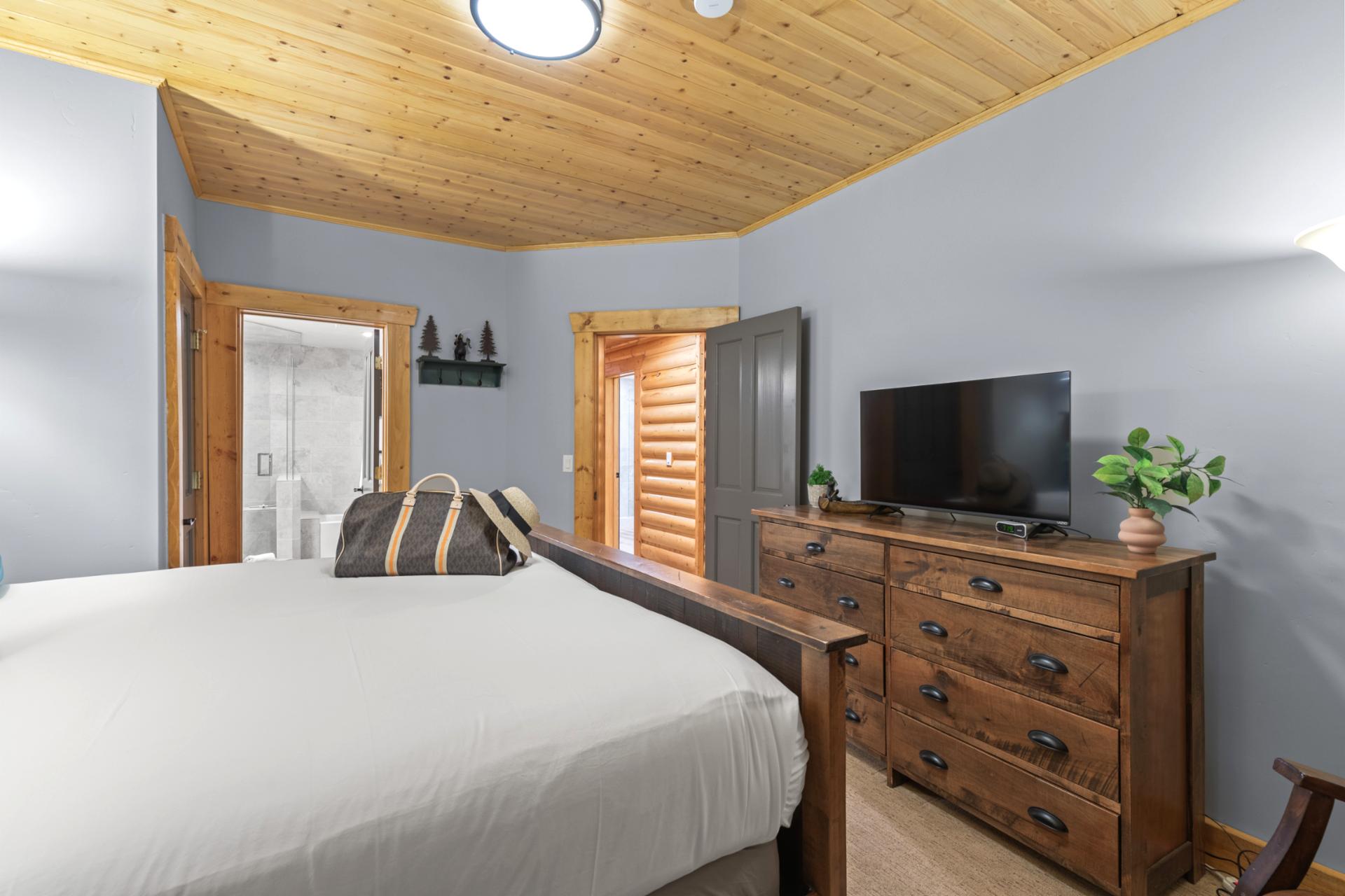 Primary bedroom includes a King bed, vaulted ceiling, and ensuite bath for added comfort.