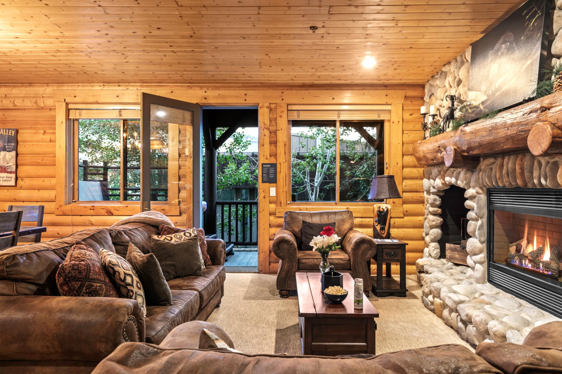 A wall of windows brings in natural light and peaceful views to the spacious living area.