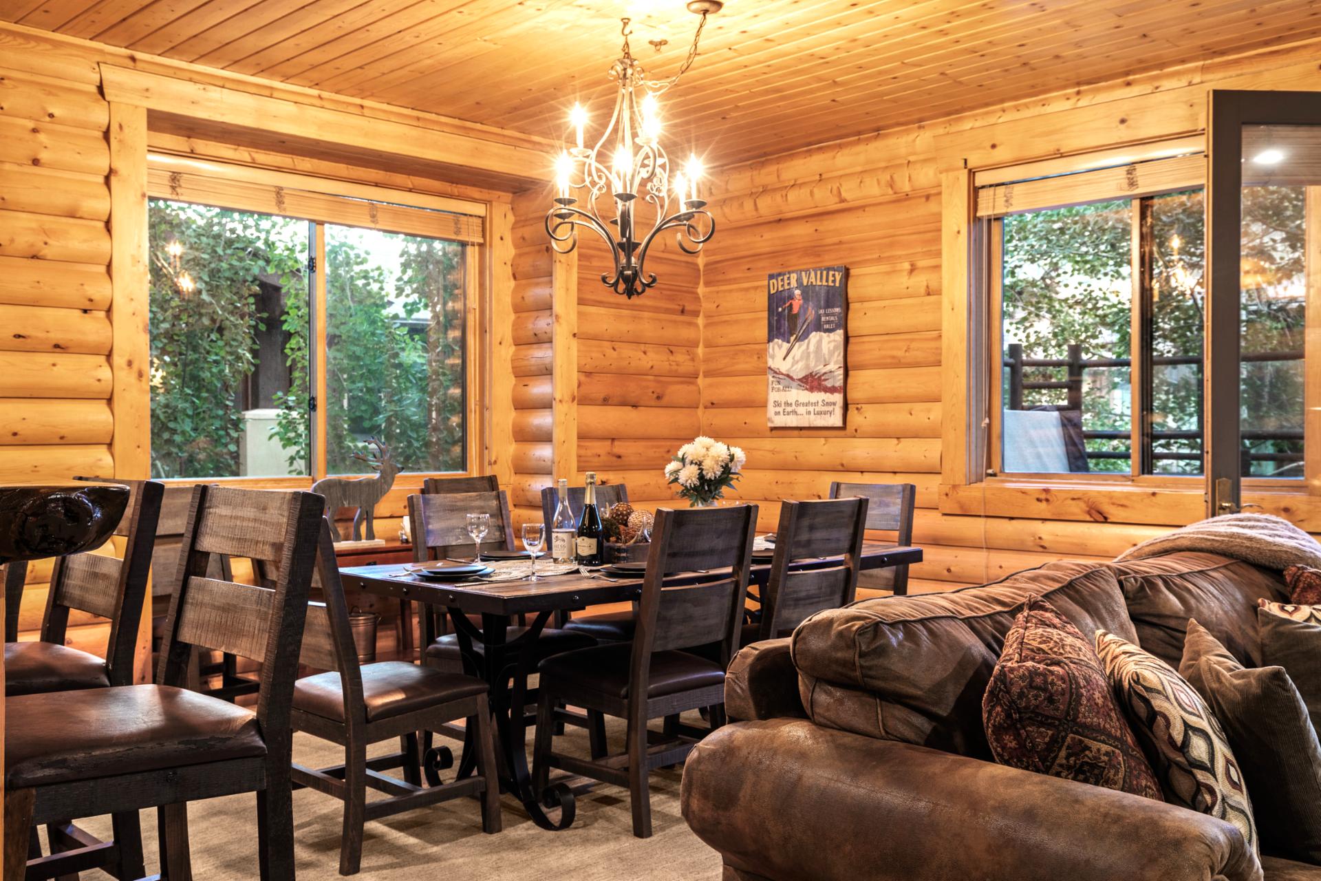 The dining area comfortably seats six under warm wood beams. Ideal for shared dinners or late-night board games.