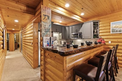 Prep meals or serve drinks with ease from this spacious and functional kitchen layout.