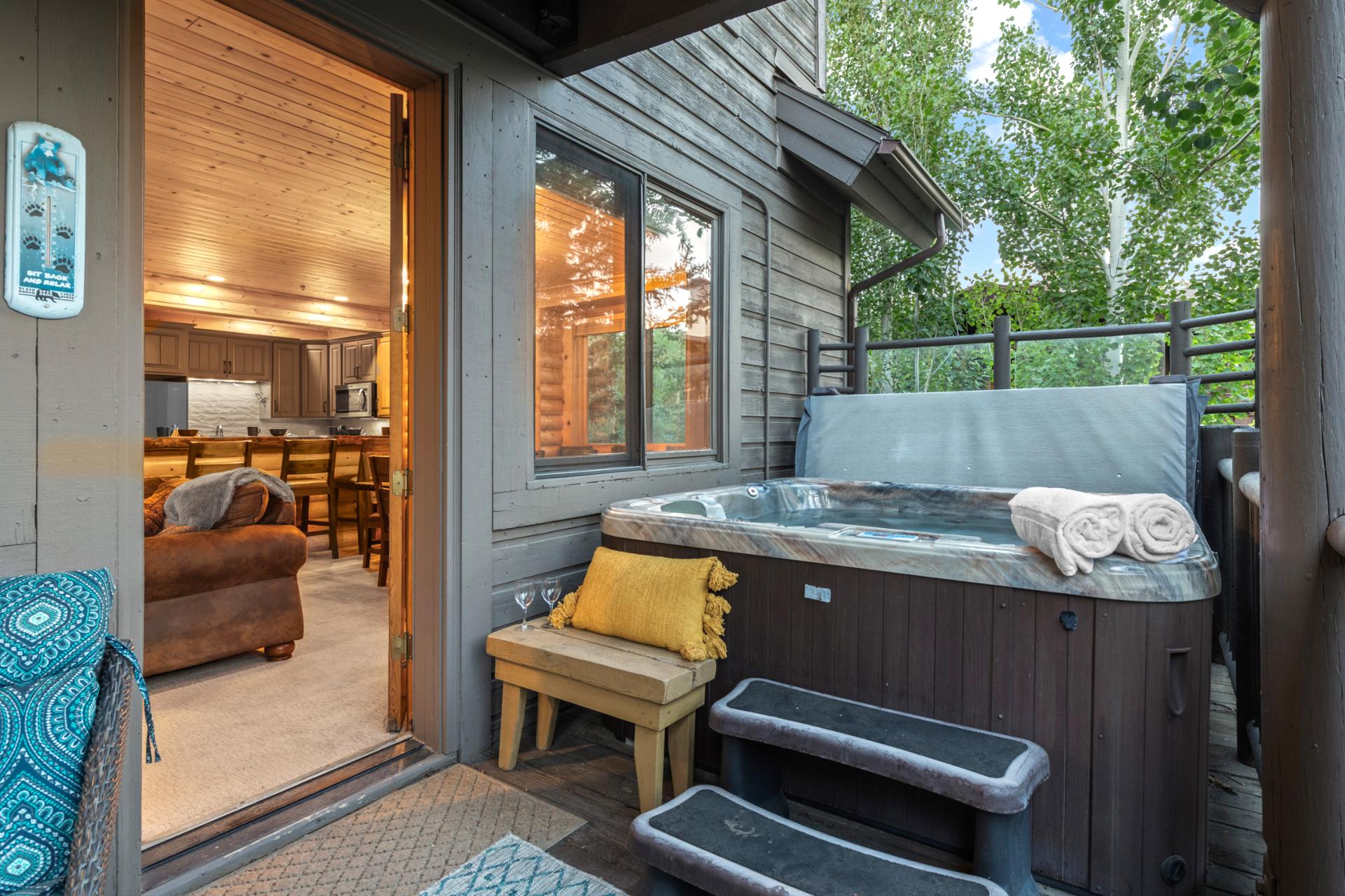 Soak in your private hot tub after a day of skiing or hiking in the mountains.