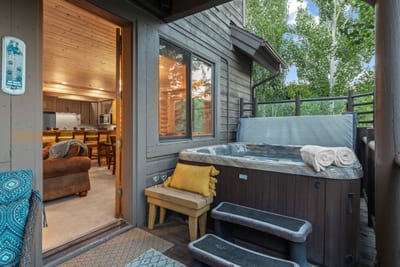 Soak in your private hot tub after a day of skiing or hiking in the mountains.