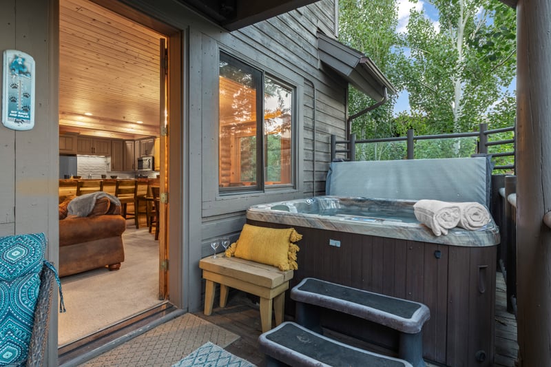 Soak in your private hot tub after a day of skiing or hiking in the mountains.