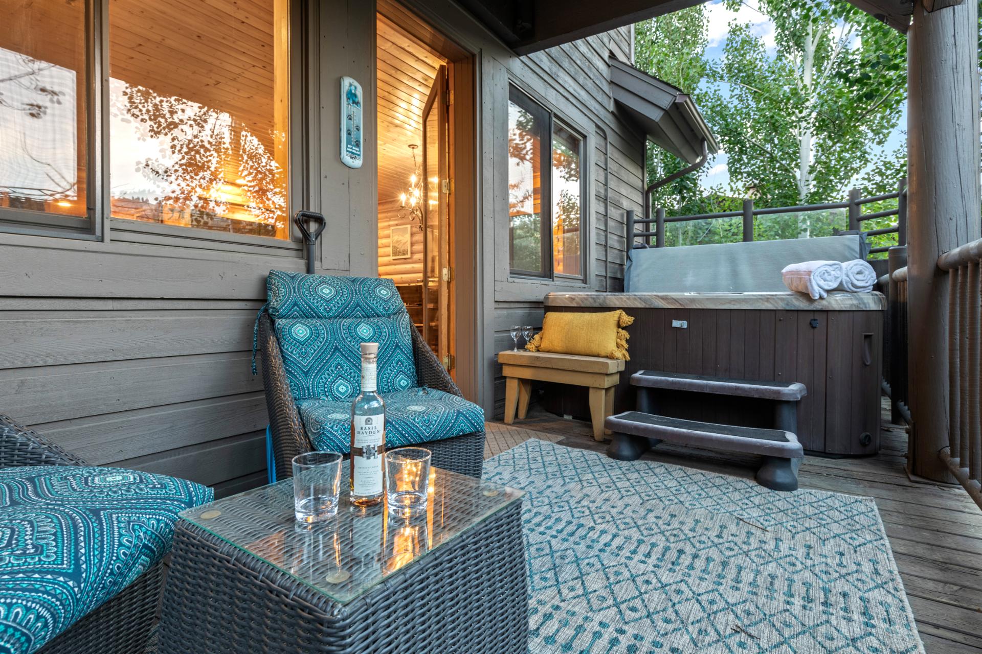 Enjoy your morning coffee or evening drink on the private balcony with cushioned seating and mountain air.