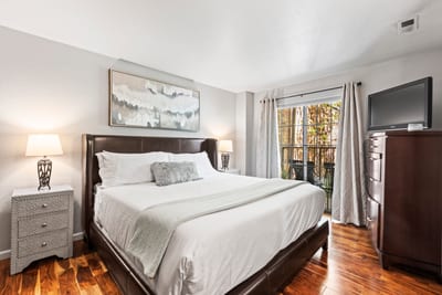Rest easy in the King bed with plush linens and enjoy morning light from the private deck.
