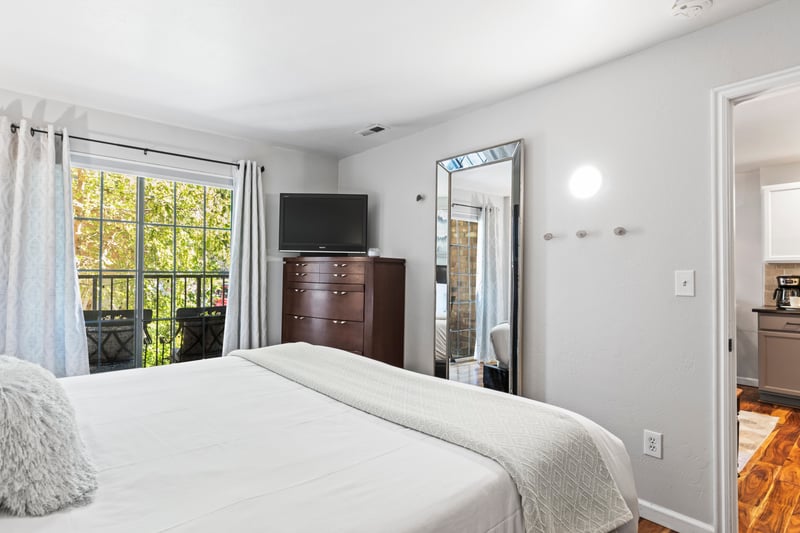 Enjoy quiet mornings with access to your private deck just steps from the bed.
