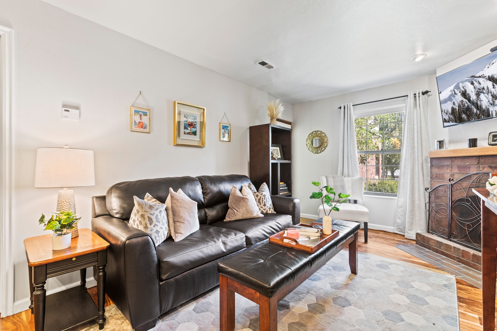 Cozy up in the open living area with a sofa sleeper, fireplace, and direct access to your private deck.