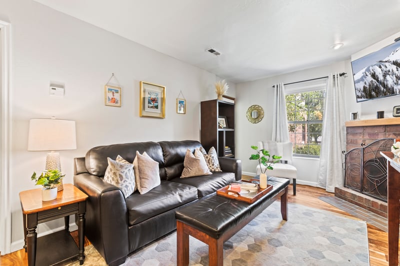 Cozy up in the open living area with a sofa sleeper, fireplace, and direct access to your private deck.