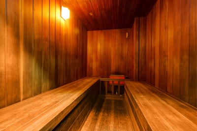 Unwind in the wood-paneled sauna after a day of alpine adventure.