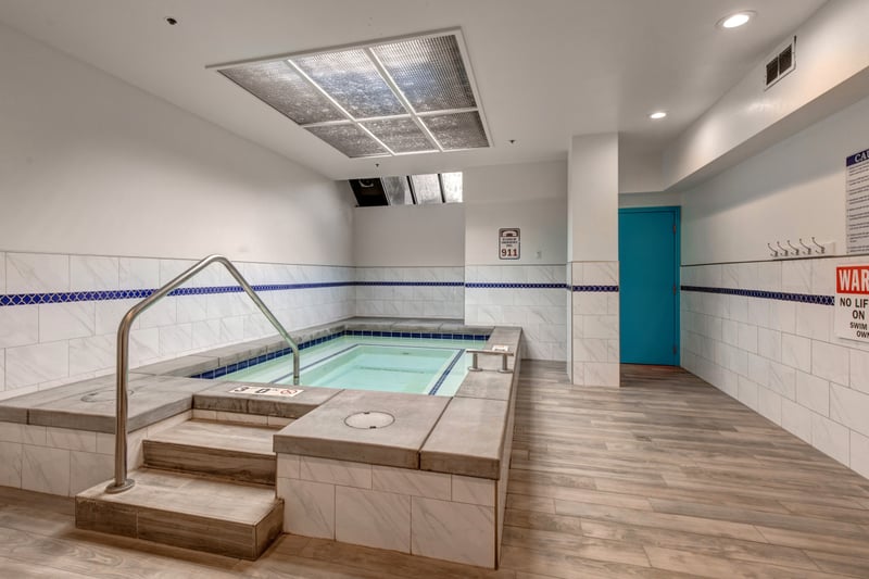 Clean and bright, this shared hot tub area offers peaceful recovery time.
