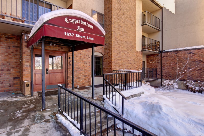 Classic mountain architecture and a covered entry welcome you home to Copperbottom Inn.