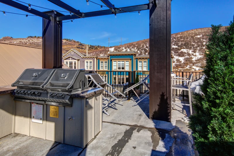 Common area: Covered grill and prep area with open sky and mountain backdrops.