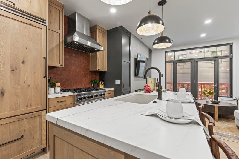 Custom cabinetry and sleek appliances blend form and function for easy at-home meals.
