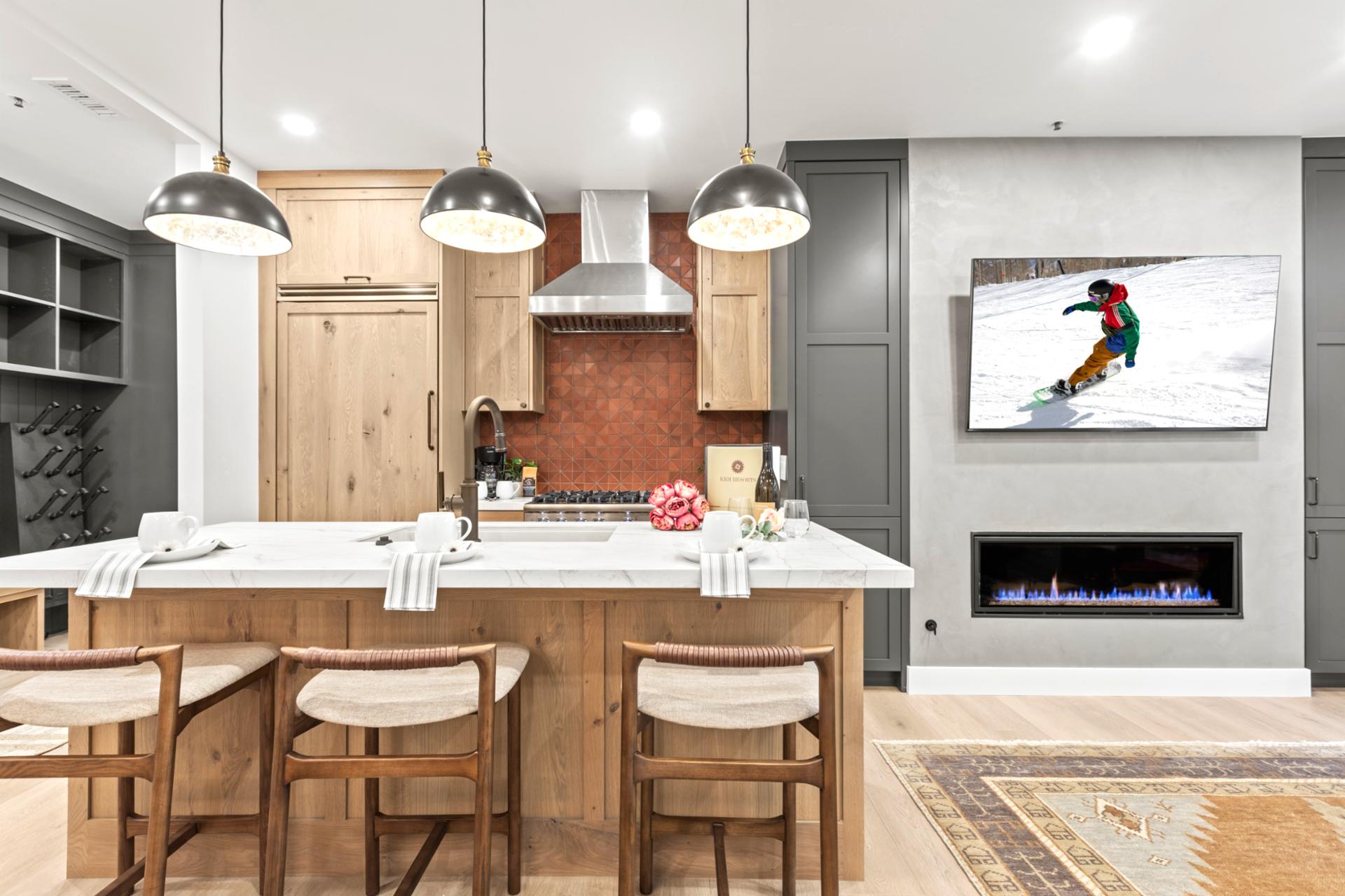 Bar seating for four and pendant lighting make this an easy place for morning coffee or casual bites.