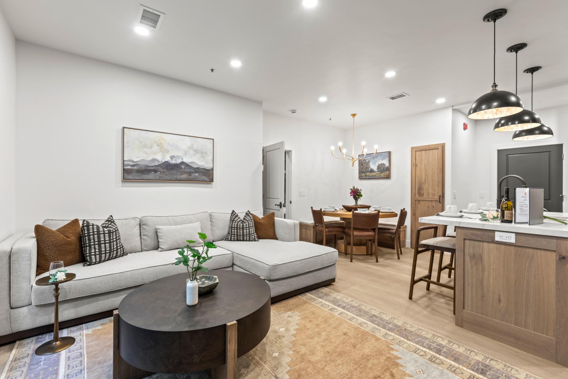 Clean lines and soft textiles give this open living area a modern, welcoming feel.