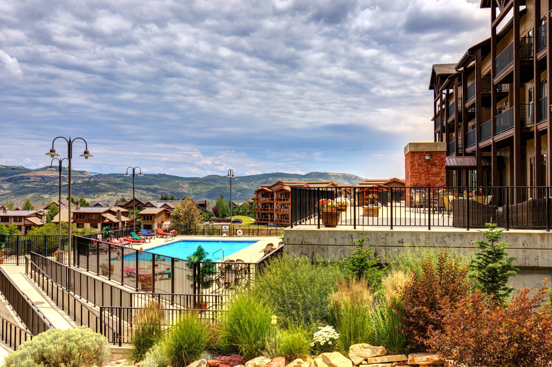 Lush landscaping and open views make this pool deck a favorite place to relax between adventures.