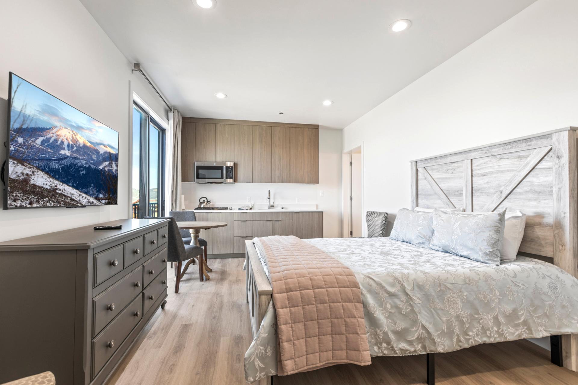 Rest easy in this main-level guest room with a Queen bed, mountain views, and direct balcony access.