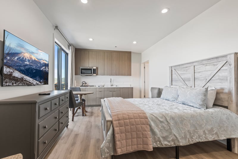 Rest easy in this main-level guest room with a Queen bed, mountain views, and direct balcony access.