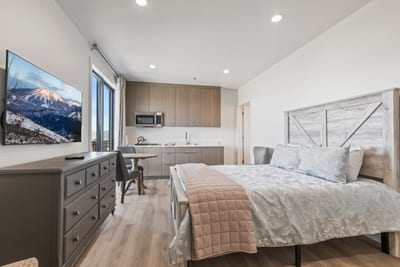 Rest easy in this main-level guest room with a Queen bed, mountain views, and direct balcony access.