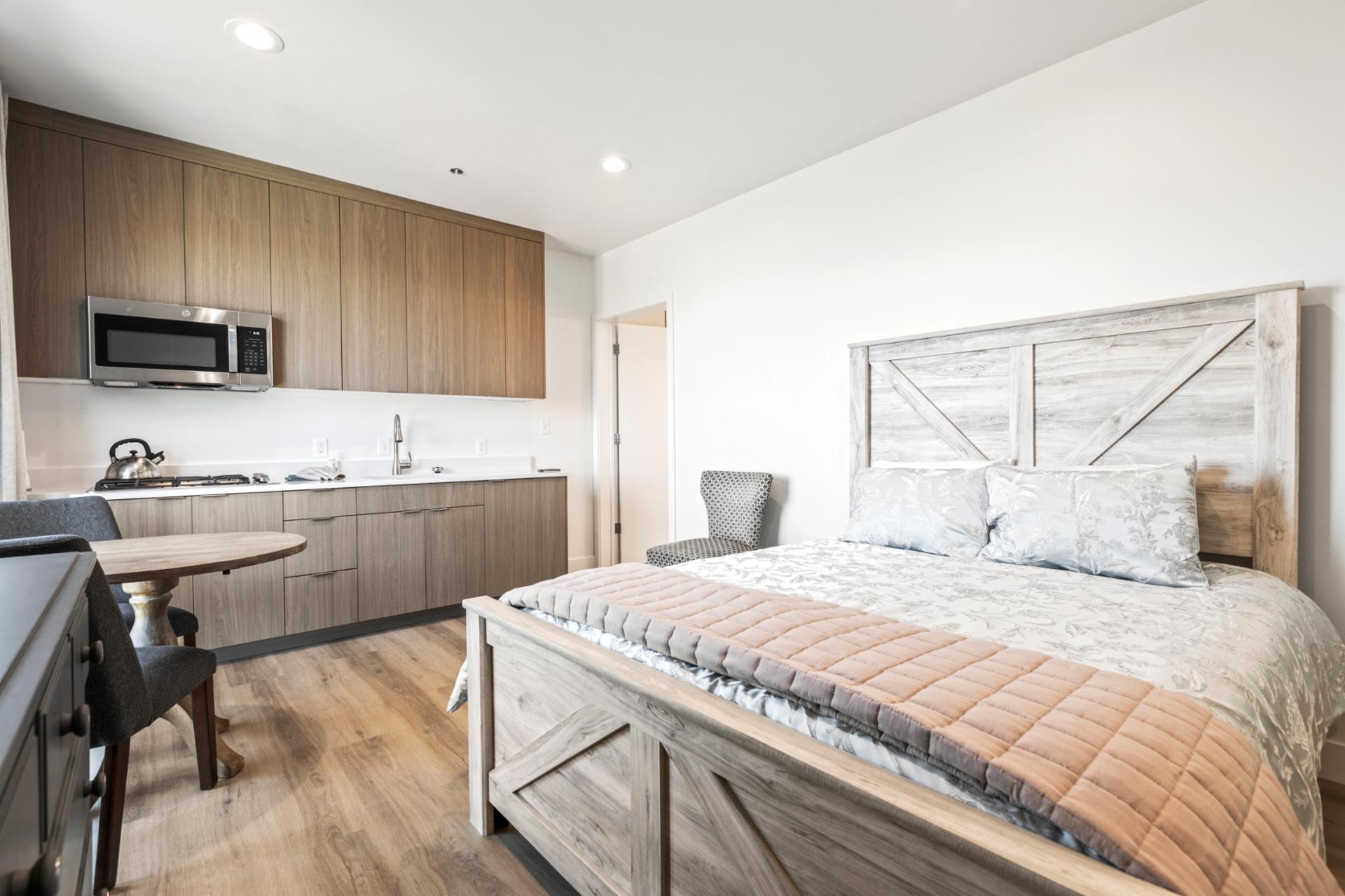 Ample space, natural light, and a comfortable Queen bed make this room great for couples or solo travelers.