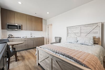 Ample space, natural light, and a comfortable Queen bed make this room great for couples or solo travelers.