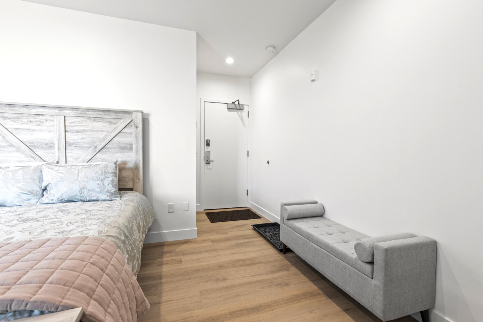 This guest suite includes a sofa and generous floor space. Perfect for relaxing or spreading out.