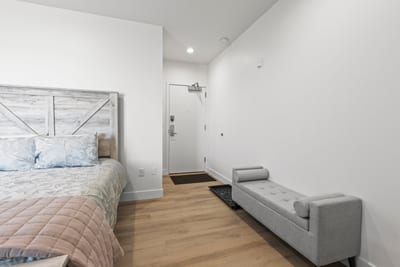 This guest suite includes a sofa and generous floor space. Perfect for relaxing or spreading out.