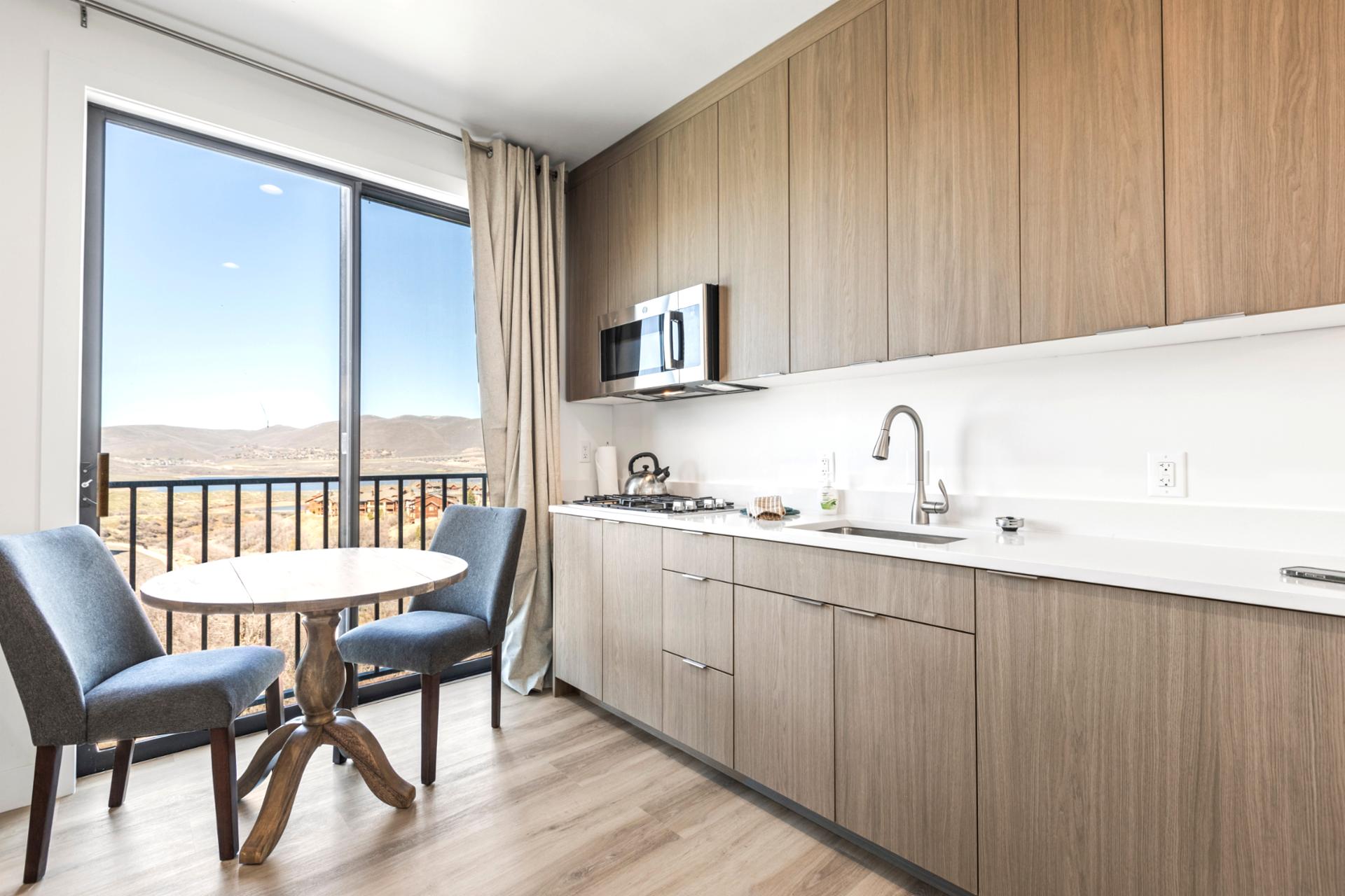 The guest suite offers a quiet table for two with direct access to the balcony and fresh air.